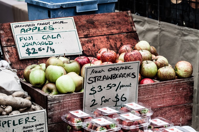 Fresh apples in baskets on display at a farmer's market